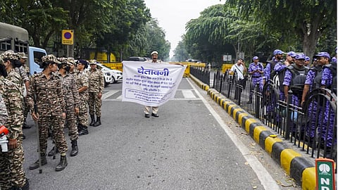 Security personnel keep vigil as heavy police deployment and entry restrictions are enforced ahead of a planned protest by Cockroach Janta Party (CJP) members, in New Delhi.