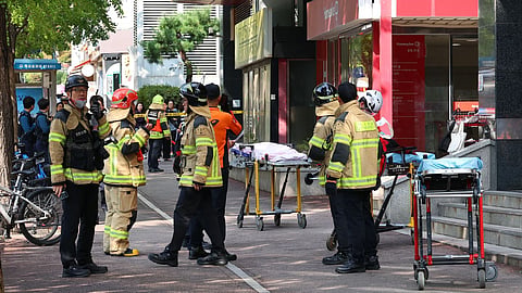 South Korean police officers and firefighters are mobilized outside of a shopping mall in Incheon, South Korea.