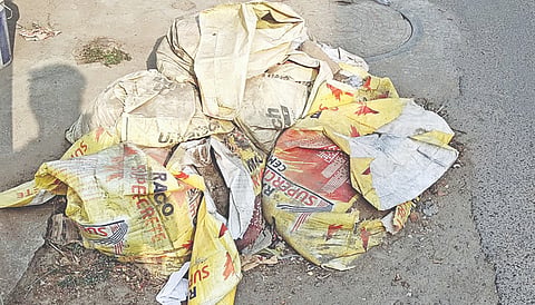 A pile of silt-filled bags lying uncleared on Vedantha Murugappa Street at Selaivayal in Kodungaiyur
