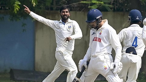 Bengal's Aamir Gani celebrates after taking the wicket of Delhi's Anuj Rawat on the fourth day of their Ranji Trophy Elite Group C match at Kalyani, West Bengal, on October 14, 2026.