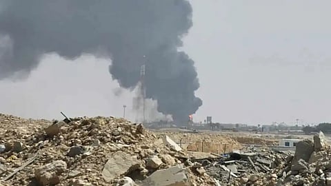 Black smoke and flames rise from an oil facility in an industrial area in southern Riyadh, Saudi Arabia, Saturday, Oct. 3, 2026.