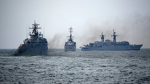 Romanian warships sail engulfed in smoke during a Romanian Navy led exercise outside Constanta, Romania.
