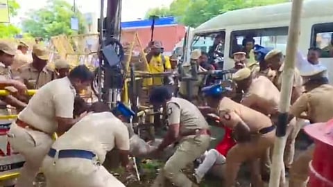 Cops bundle up members of DYFI for defying orders in Tiruchy on Friday

