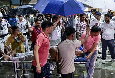 View of the closed entry gate barricaded by police following a stampede-like situation at another venue in the city, at Chetla Agrani Durga Puja pandal, in Kolkata, Saturday, Oct. 17, 2026.