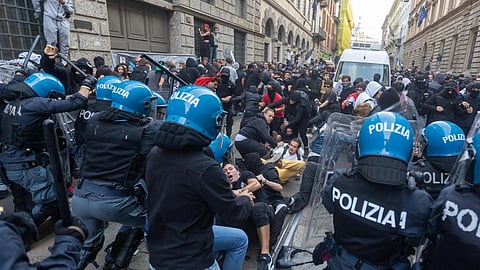 Demonstrators and riot police clash in Milan, Italy