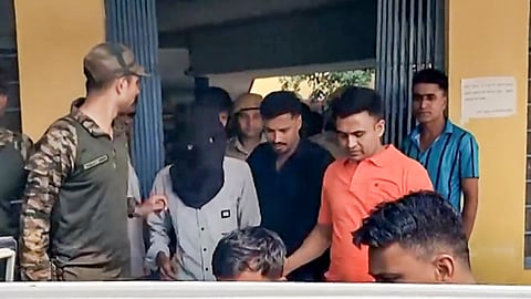 Three accused, including Ritik alias Roshan from Begusarai in Bihar and Rehan from Haryana's Sonipat, being brought out of Railway Colony Police Station after they were picked up from a train on Monday, a day after the firing at Bollywood actor Tiger Shroff's car