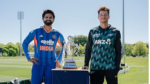 Indian captain Shreyas Iyer, left, and New Zealand captain Mitchell Santner pose with the trophy ahead of the first T20I cricket match, in Christchurch, New Zealand
