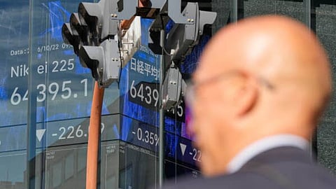 Asian shares retreat after strong profits lead a rally on Wall Street