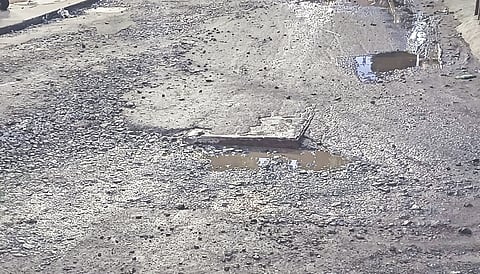 Severely battered stretch with gravels fully exposed on Patel Road in Perambur
