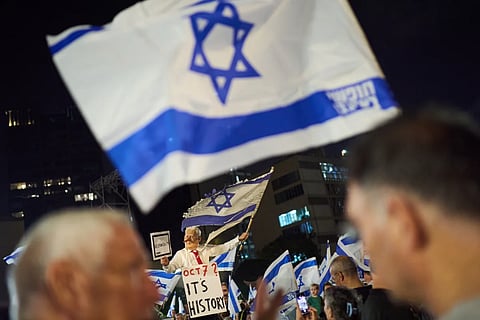 A demonstrator wearing a mask depicting Israeli Prime Minister Benjamin Netanyahu attends an anti-government protest ahead of Israel's general election, Saturday, Oct. 24, 2026
