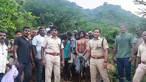 Police with the recaptured prisoners 