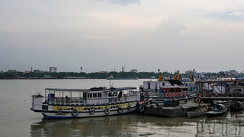 Dark clouds loom over the Hooghly river ahead of the impending landfall of cyclonic storm 'Arnab' near Visakhapatnam, in Kolkata, West Bengal