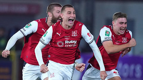 Fleetwood players celebrate after knocking Arsenal out of the League cup