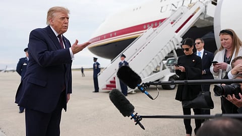 President Donald Trump speaks to reporters before boarding Air Force One