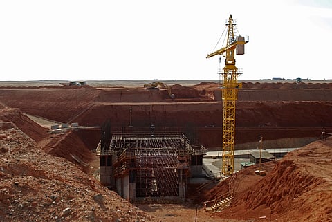 A crane hovers above the site of a new shaft under construction at the Oyu Tolgoi mine site in Khanbogd village, Umnugobi province, Mongolia, Nov. 7, 2009.