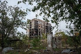 A residential building is seen damaged in Russian attacks during a local ceasefire related to a humanitarian aid mission in Oleshky, in Kherson, Ukraine, Wednesday, Oct. 28, 2026.