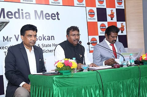 Asokan flanked by senior IndianOil officials
