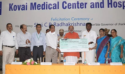 Jharkhand Governor CP Radhakrishnan receiving Rs 2.11 cr for PM’s National Relief Fund from Dr Nalla G Palaniswami, KMCH chairman