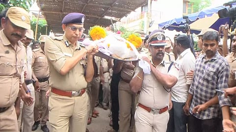 DGP Shankar Jiwal and other senior police personnel carrying the body of Vijayakumar in Theni on Friday