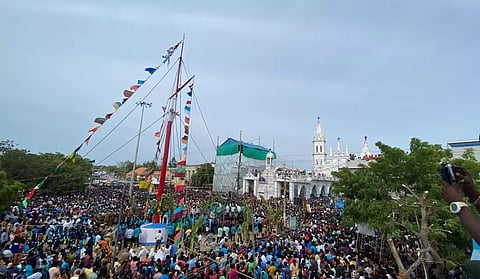 Devotees witnessing the flag hoisting for the annual festival of  Our Lady of Snow Basilica in Thoothukudi on Wednesday