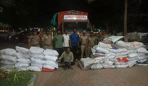 The accused with sandalwood found in secret chamber of the truck