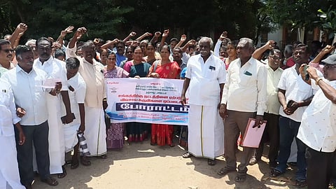 Cooperative societies employees protesting in Thanjavur on Tuesday