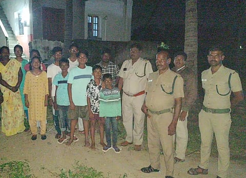 Forest officials near the house where ‘bear’ was sighted