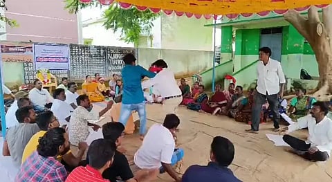 Two residents exchanging blows at the gram sabha meeting at Sundarampalli near Tirupattur on Monday