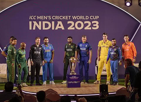 Captains of countries participating in the ICC Men’s World Cup pose with the trophy