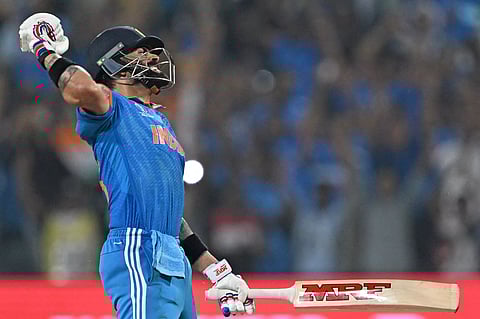 Virat Kohli celebrates after scoring a century against Bangladesh on Thursday