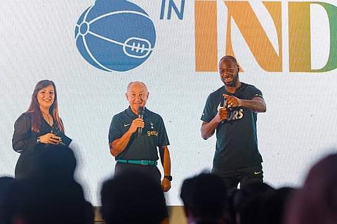Osvaldo Ardiles (M) and Ledley King (R) interact with fans during a special match screening event