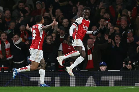 Arsenal’s Bukayo Saka celebrates scoring his team’s third goal with Gabriel Jesus