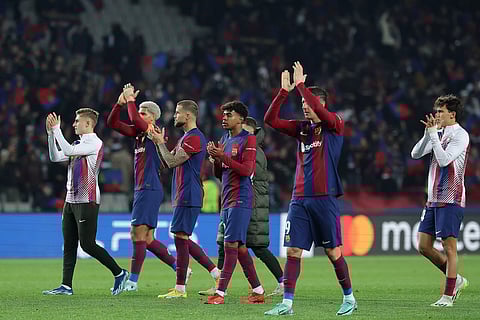 Barcelona players thank their fans after their win against FC Porto
