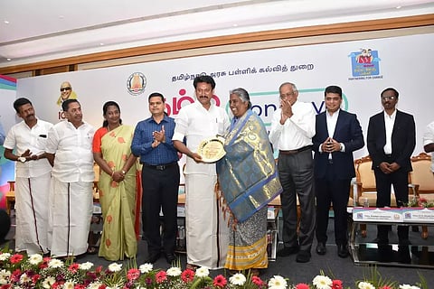 Aayi Ammal alias Pooranam, who donated her lands to government for education, being honoured by Minister Anbil Mahesh Poyyamozhi in Madurai on Monday