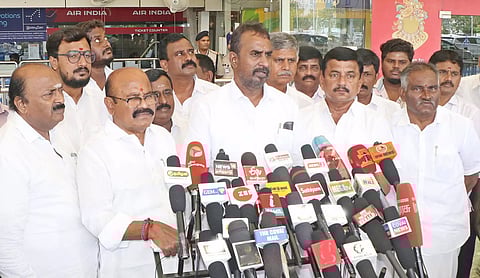 AIADMK ex-minister SP Velumani addressing reporters in Coimbatore on Monday