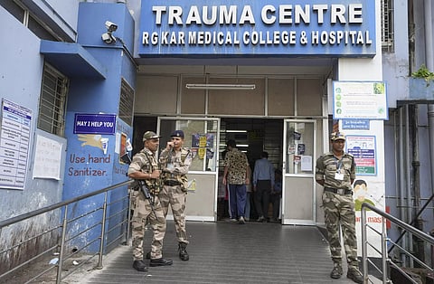 CISF personnel stand guard at RG Kar Hospital after junior doctors rejoined their duty partially on Saturday