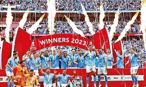 Manchester City players celebrate their FA Cup triumph