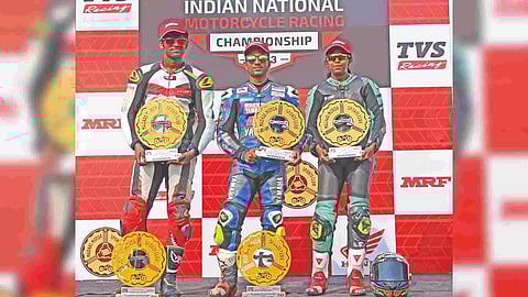 (from left) Race winners Rajiv Sethu, Mathana Kumar and Lani Fernandez pose with their prizes