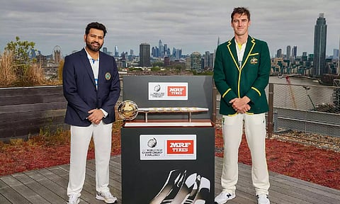 Captains of the both the sides with the trophy.