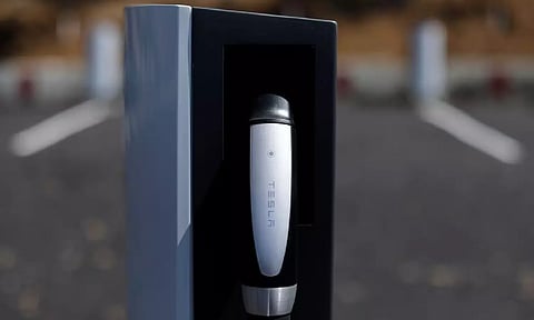 A newly installed car charger at a Tesla Super Charging station is shown in Carlsbad