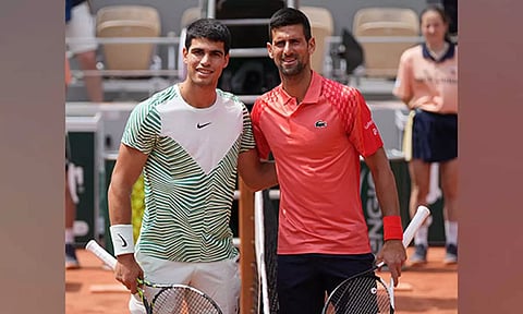 Carlos Alcaraz with Novak Djokovic