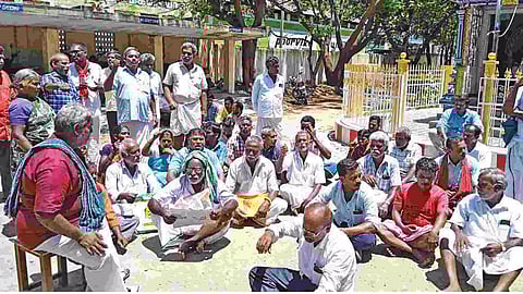 Farmers during a sit-in protest at TNCSC office
