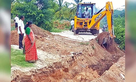 Krishnaveni Jalandhar, vice chairman, Vellore district panchayat, digging trenches in Malattar