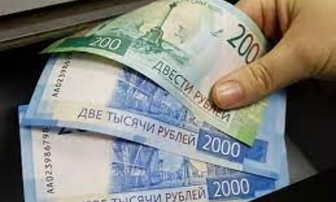 Russian rouble pares some losses as oil prices edge up