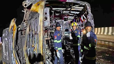 Rescue workers near the passenger bus which met with an accident (Photo: PTI)