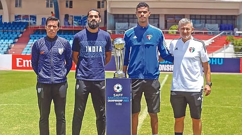 (from left) India assistant coach Mahesh Gawli, defender Sandesh Jhingan, Kuwait goalkeeper Bader Bin Saanoun and head coach Rui Bento with the SAFF trophy