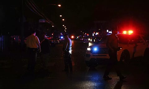 Philadelphia police stand at the intersection of 56th Street and Kingsessing Avenue after multiple people were shot in Southwest Philadelphia, late Monday, July 3, 2023. (AP)