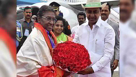 Chief Minister K Chandrashekar Rao receives President Droupadi Murmu upon her arrival at Secunderabad in Hyderabad (Photo: ANI)