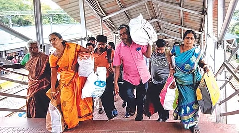 Passengers, especially those travelling on express trains, struggle to climb the stairs carrying luggage
