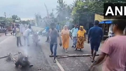 Locals blocked the road after a booth agent was killed as violence mars West Bengal Panchayat polls on Saturday (Photo: ANI)